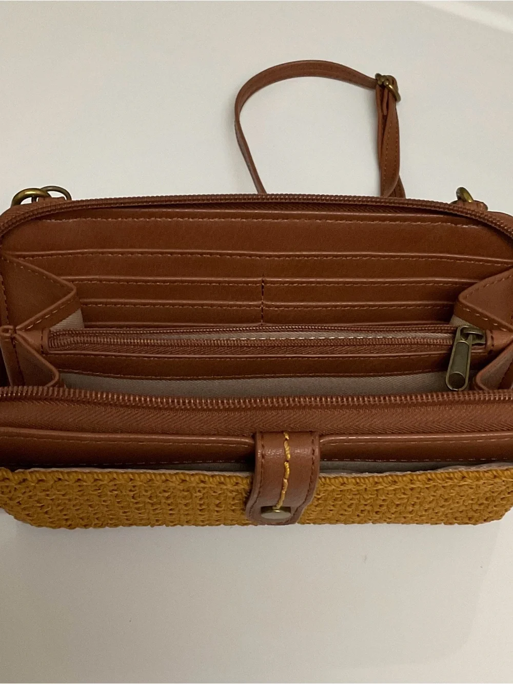 The Sak Tan Crocheted Crossbody Wallet with Adjustable Strap and charm